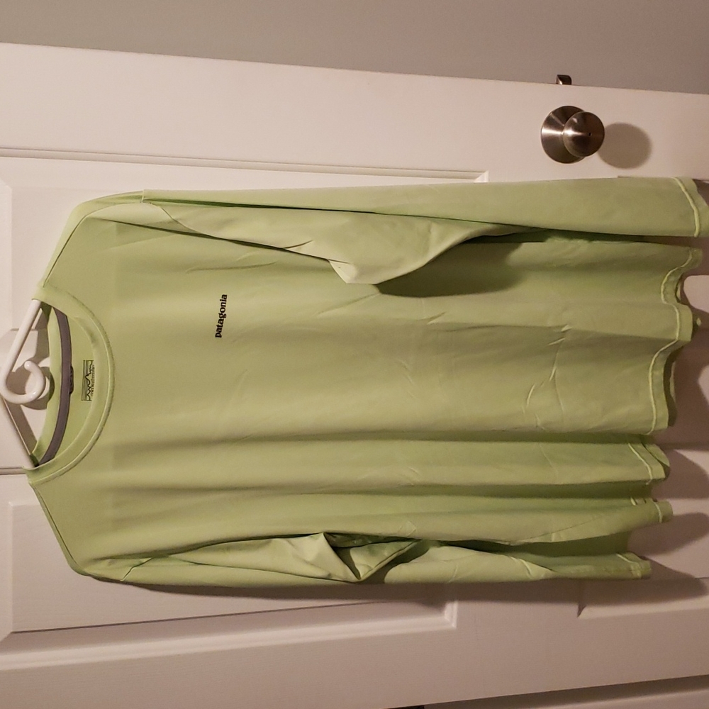 Long sleeve light green shirt.